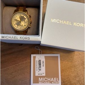 Michael Kors gold watch. Crystals surround the face.